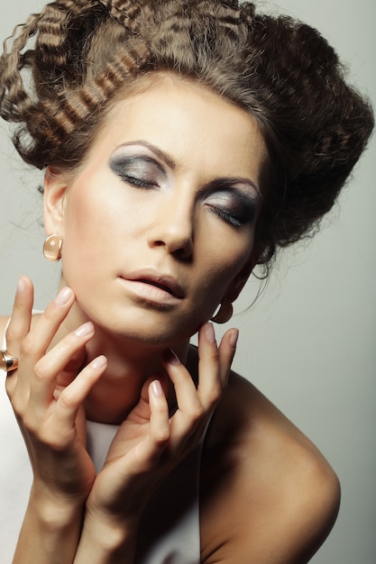 Elegant woman with luxury make up and hairstyle