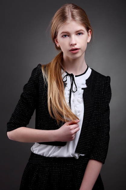 Elegant young girl posing in studio