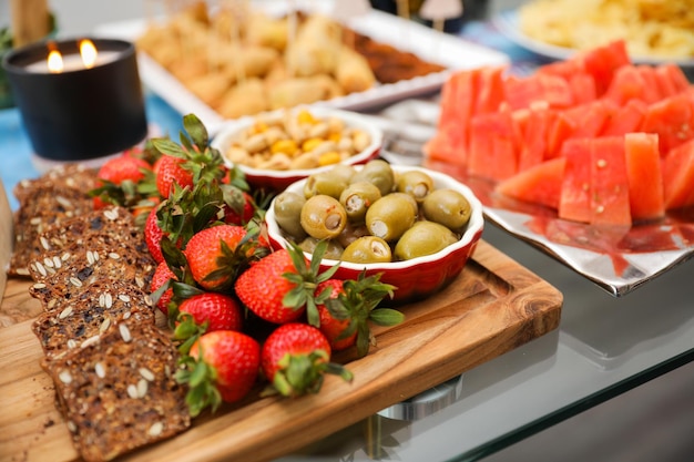 elegantly arranged charcuterie board displaying various meats cheeses fruits and nuts It symboli