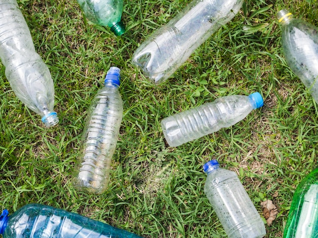 Elevated view of empty plastic bottle on grass