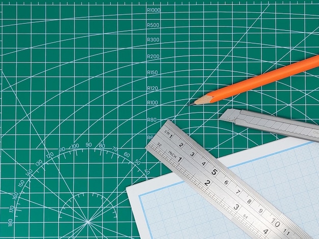 Elevated view of green cutting mat and stationary