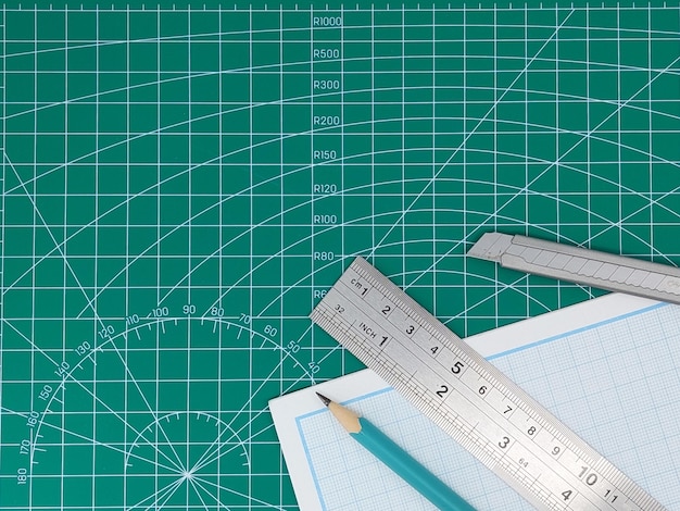 Elevated view of green cutting mat and stationary