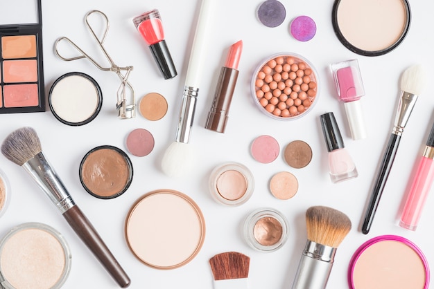 Elevated view of makeup kits on white backdrop