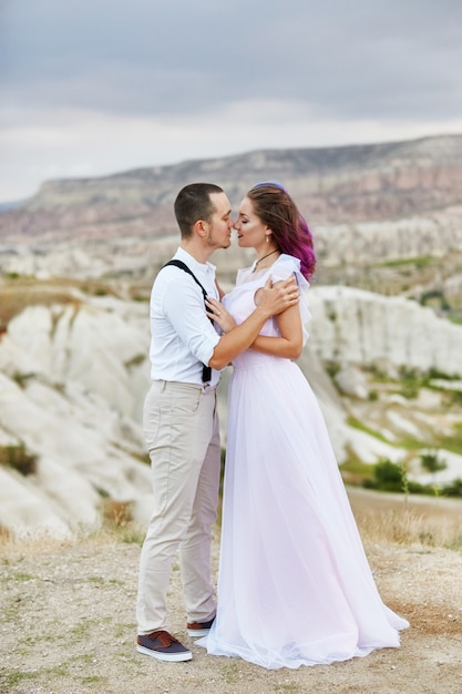 Embrace and kiss a couple in love on a spring morning in nature. Valentine's day