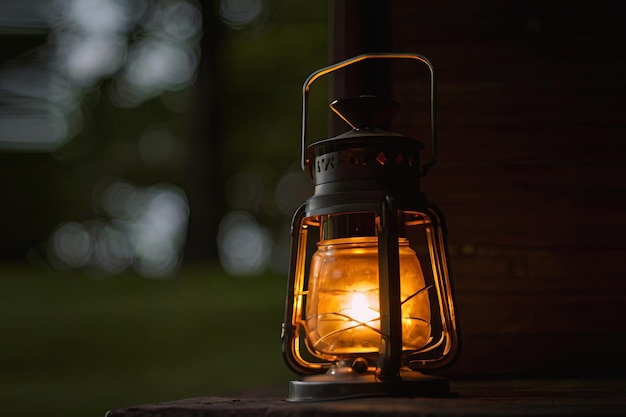 Embrace the warm glow of a lighted lantern casting a cozy ambiance