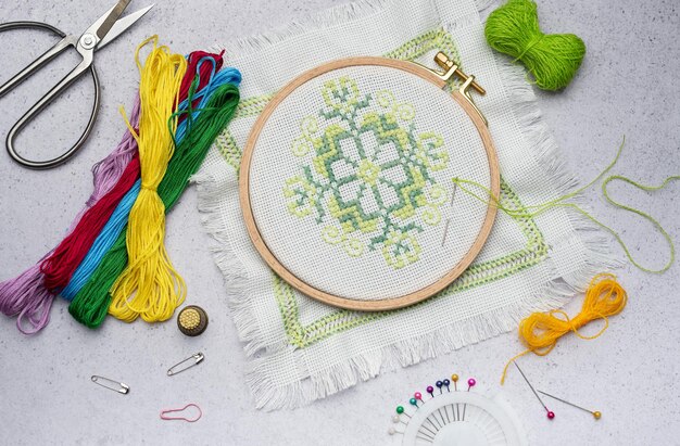 Embroidery with colored threads and various sewing accessories