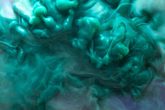 Emerald abstract background luxury smoke acrylic paint underwater explosion cosmic swirling aquamarine ink