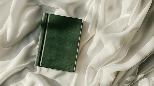 an emeraldcovered diary set against a luxurious white cream silk background exuding sophistication and style