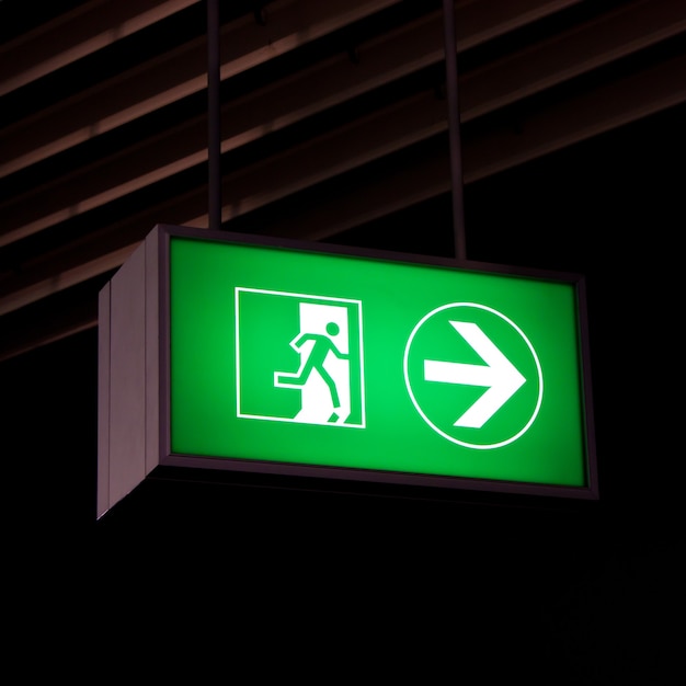 Emergency exit sign in modern offices inside an industrial plant