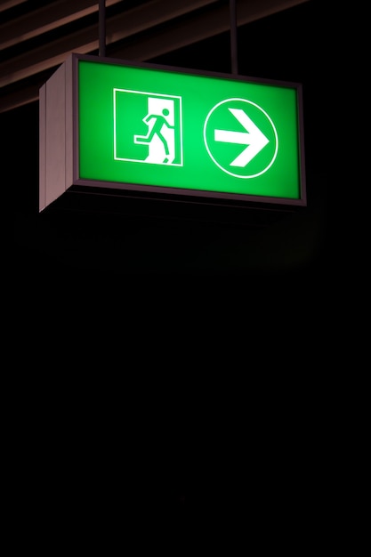 Emergency exit sign in modern offices inside an industrial plant