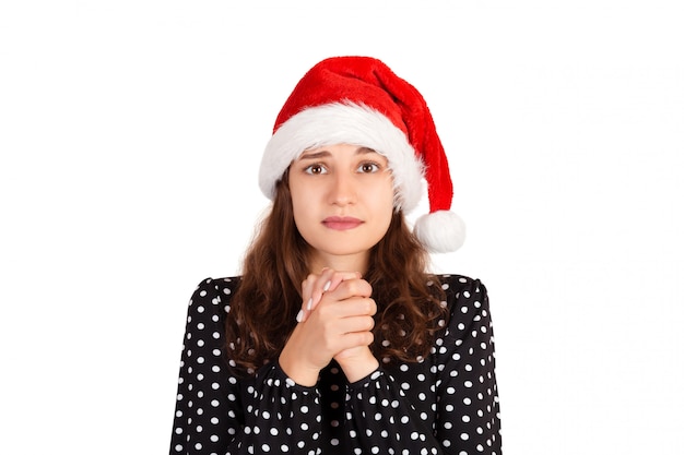 emotional girl in santa claus christmas hat 