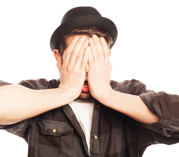 emotional happiness and people concept Young man wearing black hatStudio shot over white background