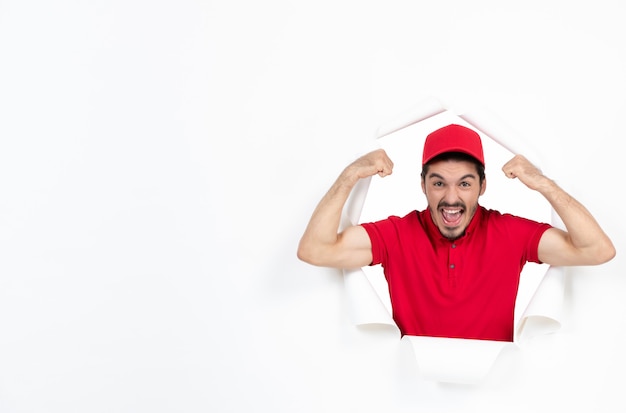 Emotional male courier in uniform on white