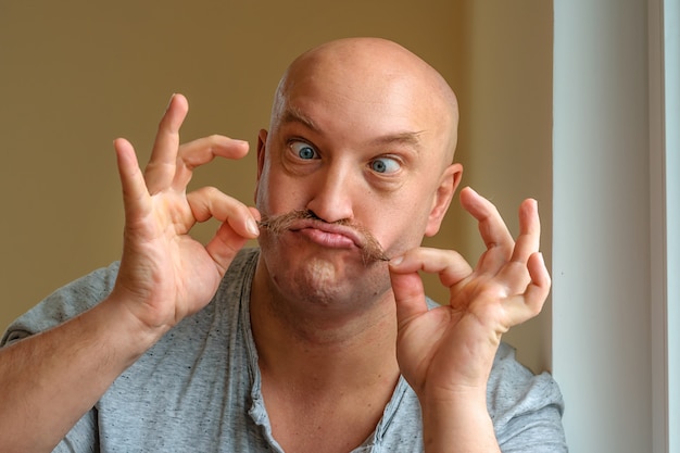 an emotional man with a mustache different facial expressions on the face