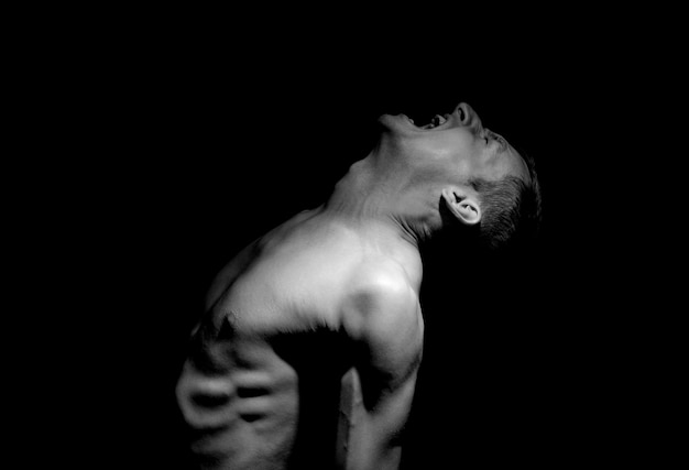 Emotional photo, man shouting on black background