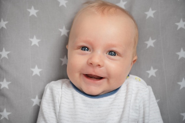 Emotional portrait of baby Portrait of smiling newborn baby with open mouth closeup Happy smile