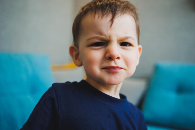 Emotions on the face of a twoyearold little boy an emotional child A boy with different grimaces on his face