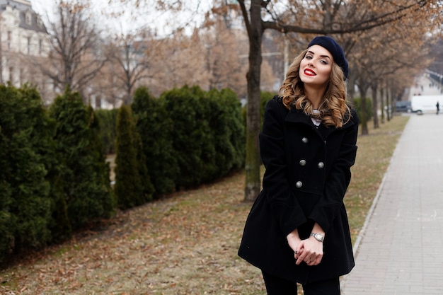 Emotions, people, beauty and lifestyle concept - Girl Frenchwoman. Street photo of young woman wearing stylish classic clothes. Female fashion concept. French style.