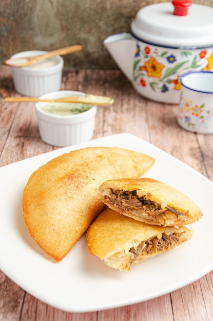 Empanadas Traditional Venezuelan food by guasacas Rustic and wooden background