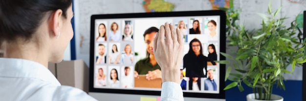 Employee is talking via video link with colleagues