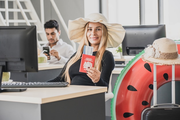 Employee in office ready to travel on summer vacation holidays.