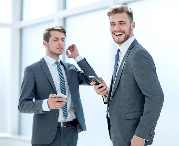 Employees standing in the office hallway