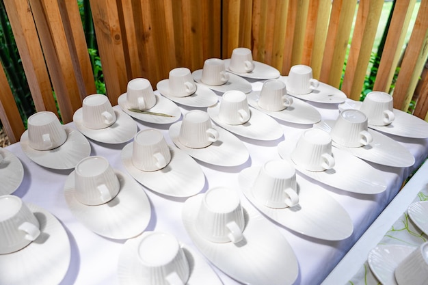 Emptry cup of tree arranged on table with wood barttens background