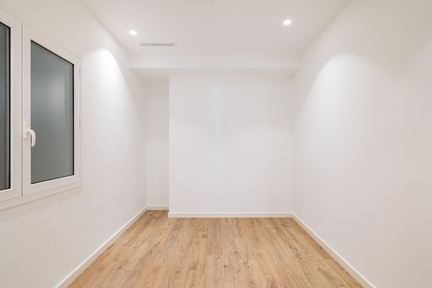 Empty apartment room with wooden floor in a new flat for rent