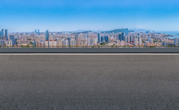 Empty asphalt road and city skyline and building landscape, China.