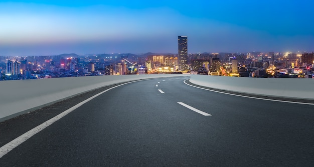 Empty asphalt road and city skyline and building landscape, China.