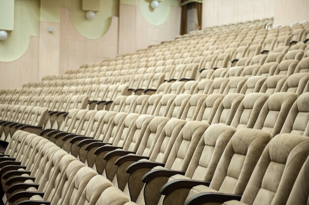 Photo empty auditorium with beige chairs, theatre or conference hall