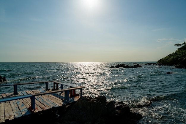 empty balcony and wooden bench with coast and sea background at Chedi Klang Nam in Chanthaburi Thailand