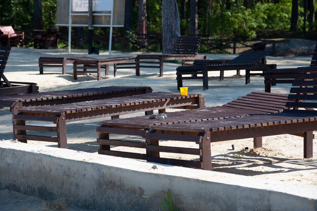 empty beach with sun loungers and baby cakes