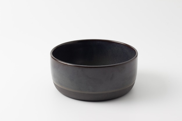 Empty black bowl isolated on white background