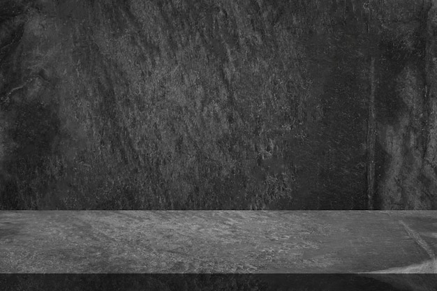 Photo empty black marble table top with black stone wall texture background