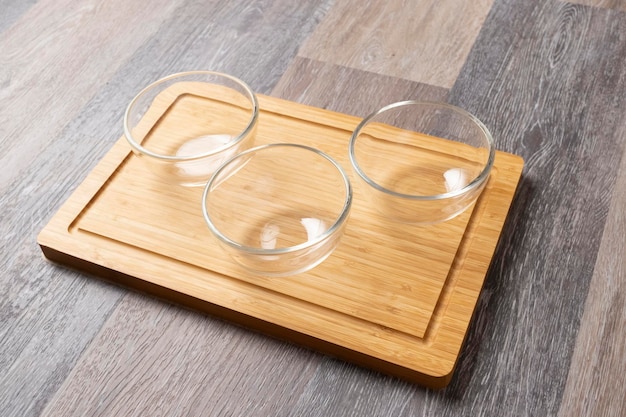 Empty bowls with breakfast ingredients on a wooden table