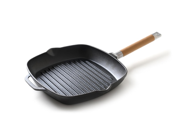 Empty cast iron grill pan with handle isolated on white background