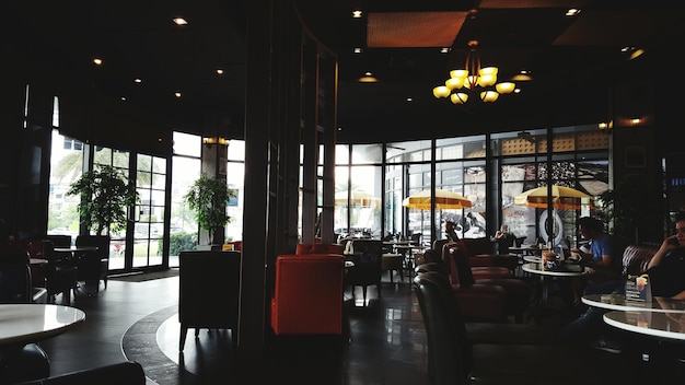 Empty chairs and tables in restaurant