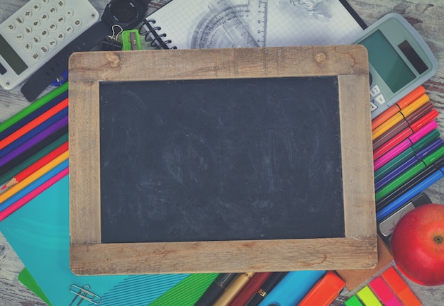 Empty Chalkboard with copy space and school supplies