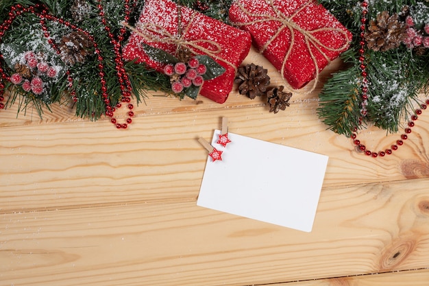 Empty Christmas card on a wooden table