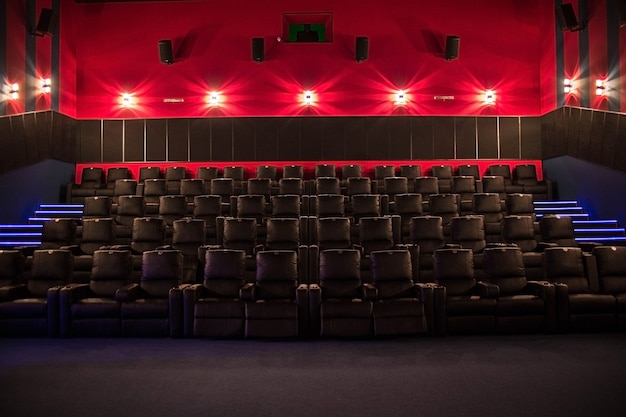 Empty cinema, cinema with soft chairs before the premiere of the film. There are no people in the cinema.