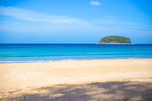 Empty clean beach with white sand and blue sea on a sunny day Tropical island in the sea