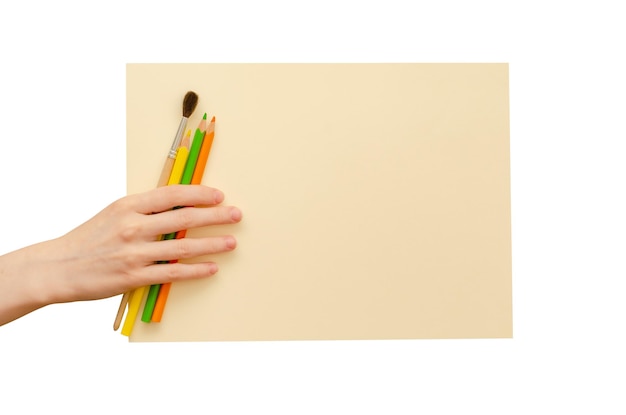 An empty colored poster in his hand and pencils Isolated on a white background Copy space