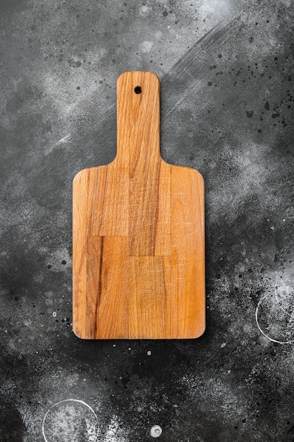 Empty cutting board set, on black dark stone table background, top view flat lay , with copy space for text or your product