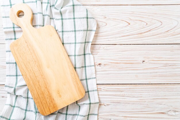 empty cutting wooden board with kitchen cloth