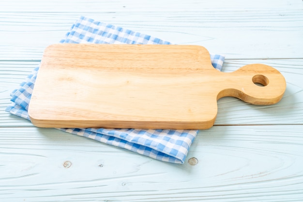 empty cutting wooden board with kitchen cloth