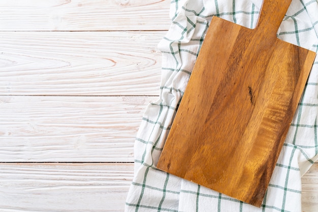 empty cutting wooden board with kitchen cloth