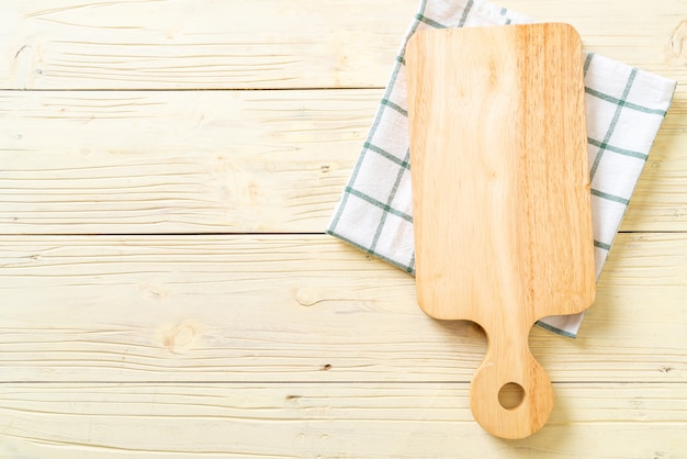 empty cutting wooden board with kitchen cloth