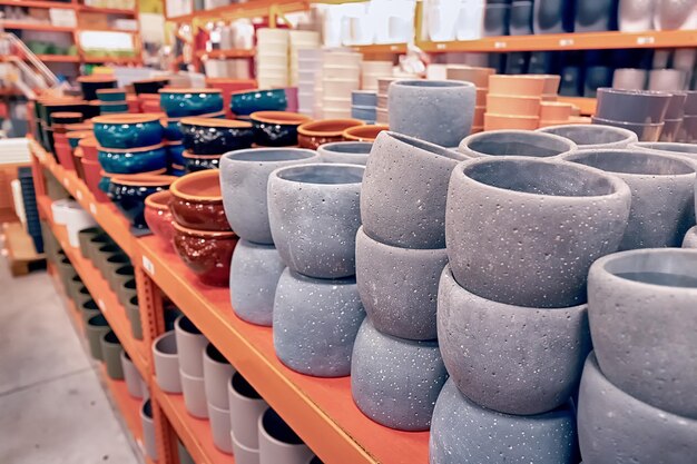 Empty decorative flower pots for sale at gardening or earthenware shop