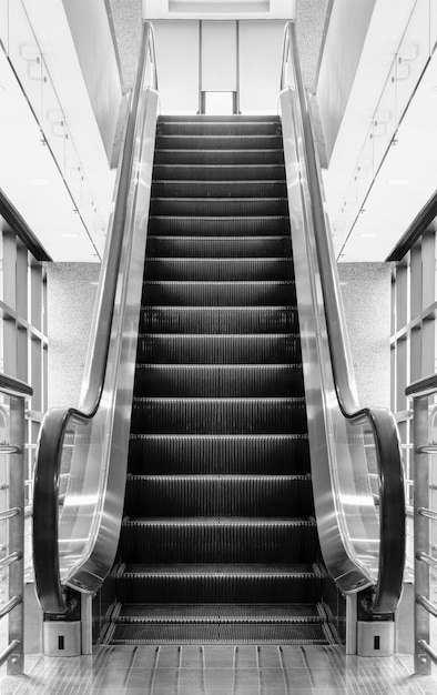 Empty escalator stairs in shopping mall